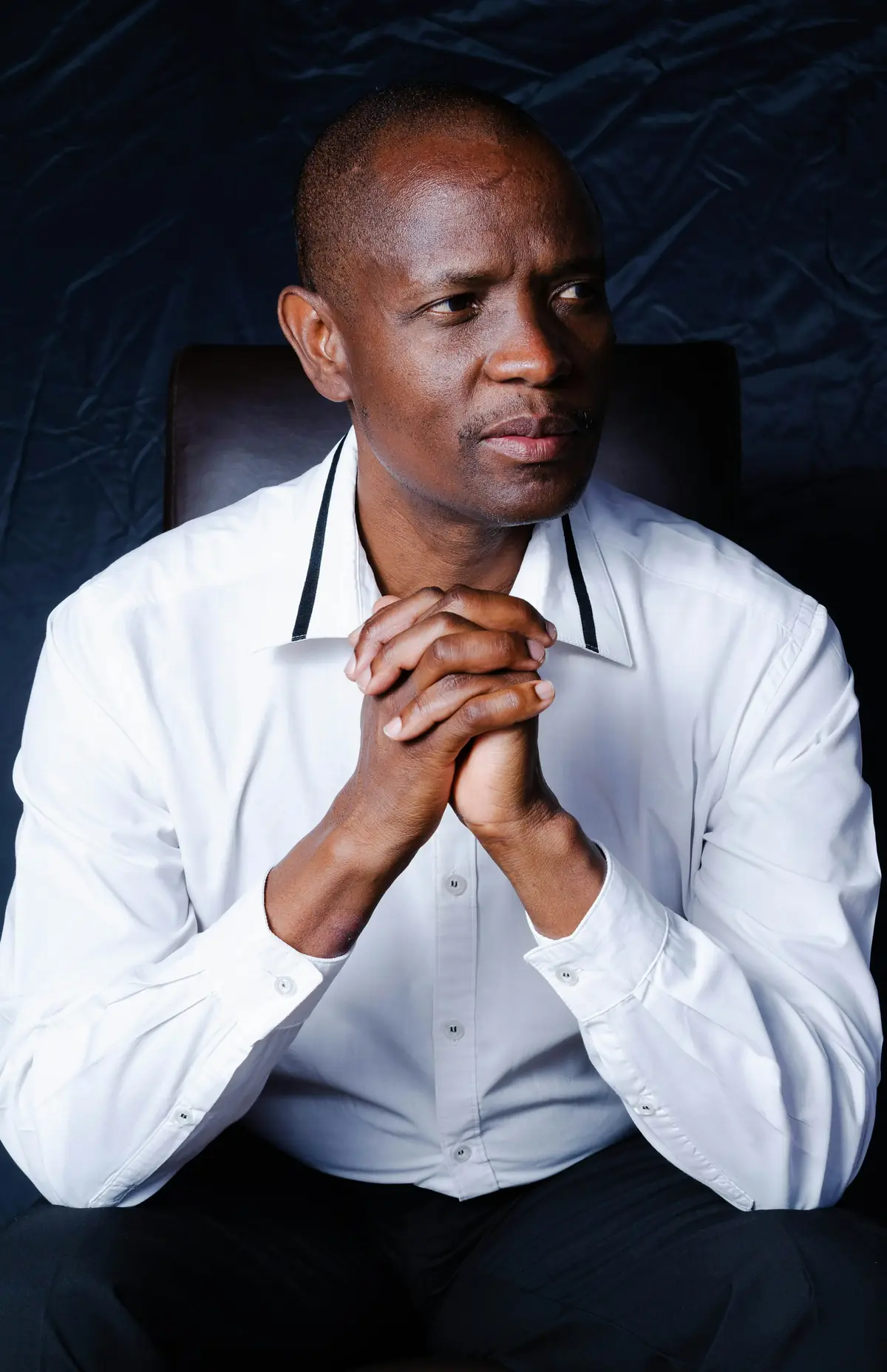 Attorney Samuel Adeyemi in a white shirt